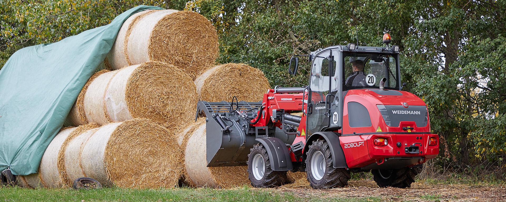 Weidemann telescopic wheel loader 2080LPT cabin with power grab bucket in action